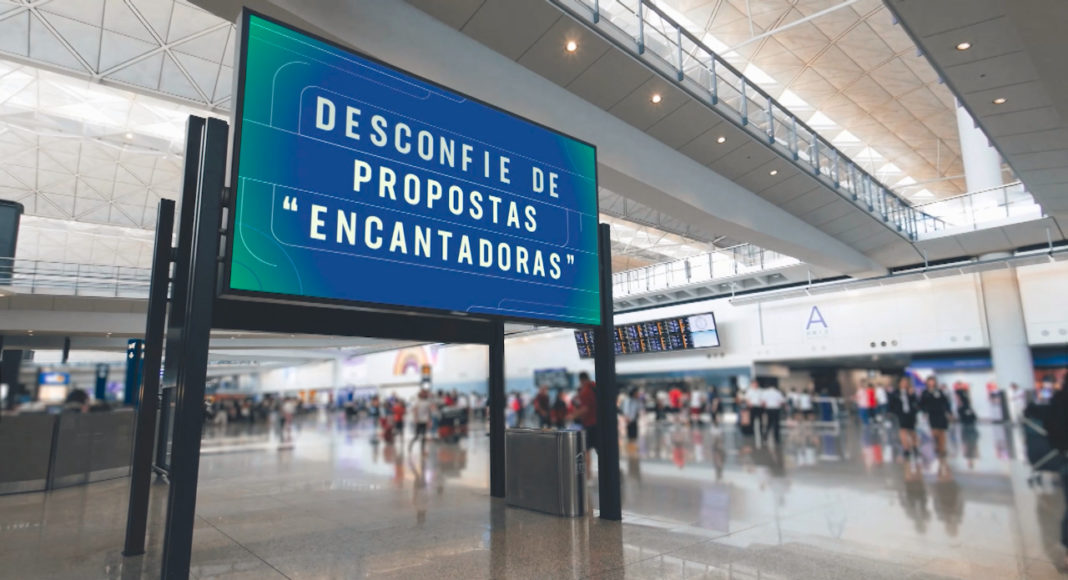 Cartaz em aeroporto com os dizeres Desconfie de propostas encantadoras, peça de edições anteriores da campanha contra o tráfico de pessoas